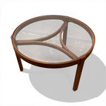 Load image into Gallery viewer, Round wooden coffee table with glass top on a white background
