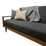 Load image into Gallery viewer, Gray sofa with wooden armrests, plaid blanket, and pillows on a white background
