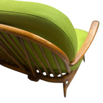 Load image into Gallery viewer, spindle back sofa with green cushions
