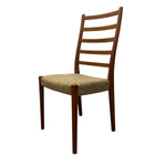 Load image into Gallery viewer, Wooden chair with a woven seat on a white background
