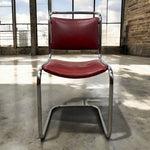 Load image into Gallery viewer, tubular steel chair in an industrial unit
