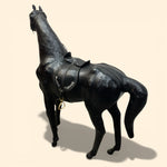 Load image into Gallery viewer, Black horse figurine with a saddle on a beige background
