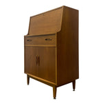 Load image into Gallery viewer, Mid-century modern wooden writing desk cabinet with a slanted top, one drawer, two lower doors, and tapered legs, shown on a plain white background.
