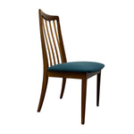 Load image into Gallery viewer, A mid-century modern wooden dining chair with a tall slatted backrest and a teal upholstered seat cushion, shown against a plain white background.
