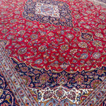 Load image into Gallery viewer, Close-up of a red Persian rug with intricate patterns
