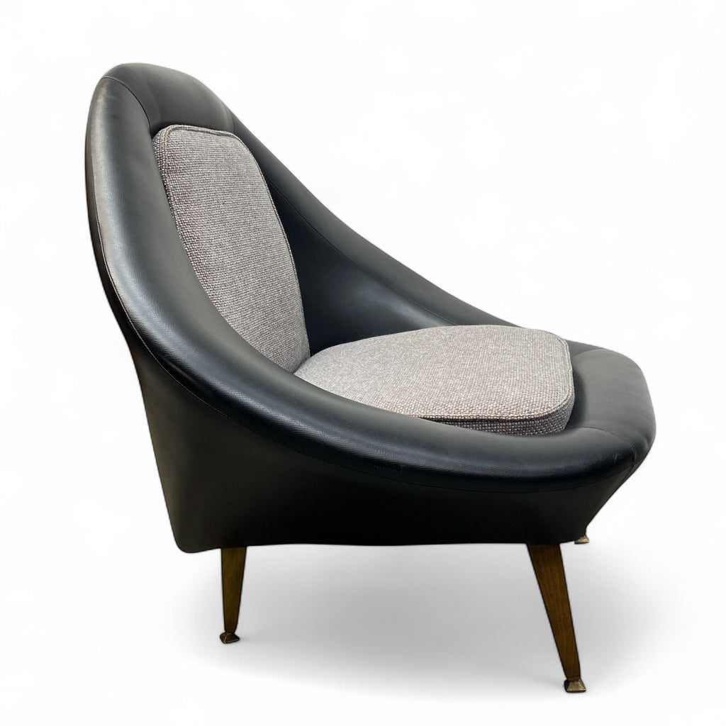 Modern chair with black vinyl and grey fabric on a white background