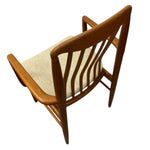 Load image into Gallery viewer, Wooden chair with a beige cushion on a white background
