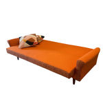 Load image into Gallery viewer, Orange sofa BED with a patterned pillow on a white background
