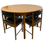 Load image into Gallery viewer, CIRCULAR TEAK DINING TABLE AND FOUR VINYL DINING CHAIRS
