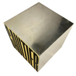 Load image into Gallery viewer, A metallic cube-shaped side table or stool with a brushed silver/chrome finish and bold black 'CHAUMIER' lettering on one side, shown on a plain white background.
