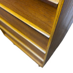 Load image into Gallery viewer, Close-up of a wooden shelf or cabinet corner with warm medium-brown wood grain and light natural wood trim, isolated on a white background.
