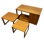 Load image into Gallery viewer, Set of three wooden nesting tables on a white background
