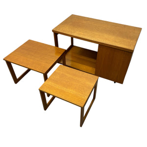 Set of three wooden nesting tables on a white background