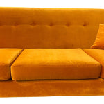 Load image into Gallery viewer, A close-up of a mustard yellow velvet sofa with a button-tufted backrest, matching seat cushion, and a partial side pillow on a white background.
