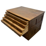 Load image into Gallery viewer, A vintage wooden chest of drawers with a dark brown finish and five drawers pulled out, showing brass handles, on a plain white background.
