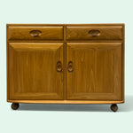 Load image into Gallery viewer, Wooden cabinet with two doors and two drawers on a light gray background
