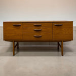 Load image into Gallery viewer, Wooden dresser with three drawers on a plain background
