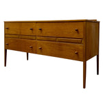 Load image into Gallery viewer, Mid-century modern wooden sideboard with six drawers, tapered legs, and round dark metal pulls, shown on a plain white background.
