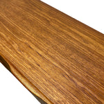 Load image into Gallery viewer, A close-up of a polished wood surface with a warm medium-brown grain and a slightly beveled edge, shown against a white background.
