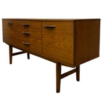 Load image into Gallery viewer, Wooden dresser with multiple drawers on a white background
