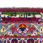 Load image into Gallery viewer, Close-up of a colorful patterned fabric with intricate designs
