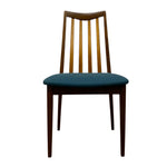 Load image into Gallery viewer, A mid-century modern wooden dining chair with a curved backrest, vertical slats, and a dark teal upholstered seat cushion, shown against a plain white background.
