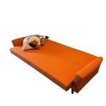 Load image into Gallery viewer, Orange sofa bed with decorative pillows on a white background
