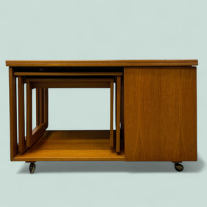 Set of wooden nesting tables on a light gray background