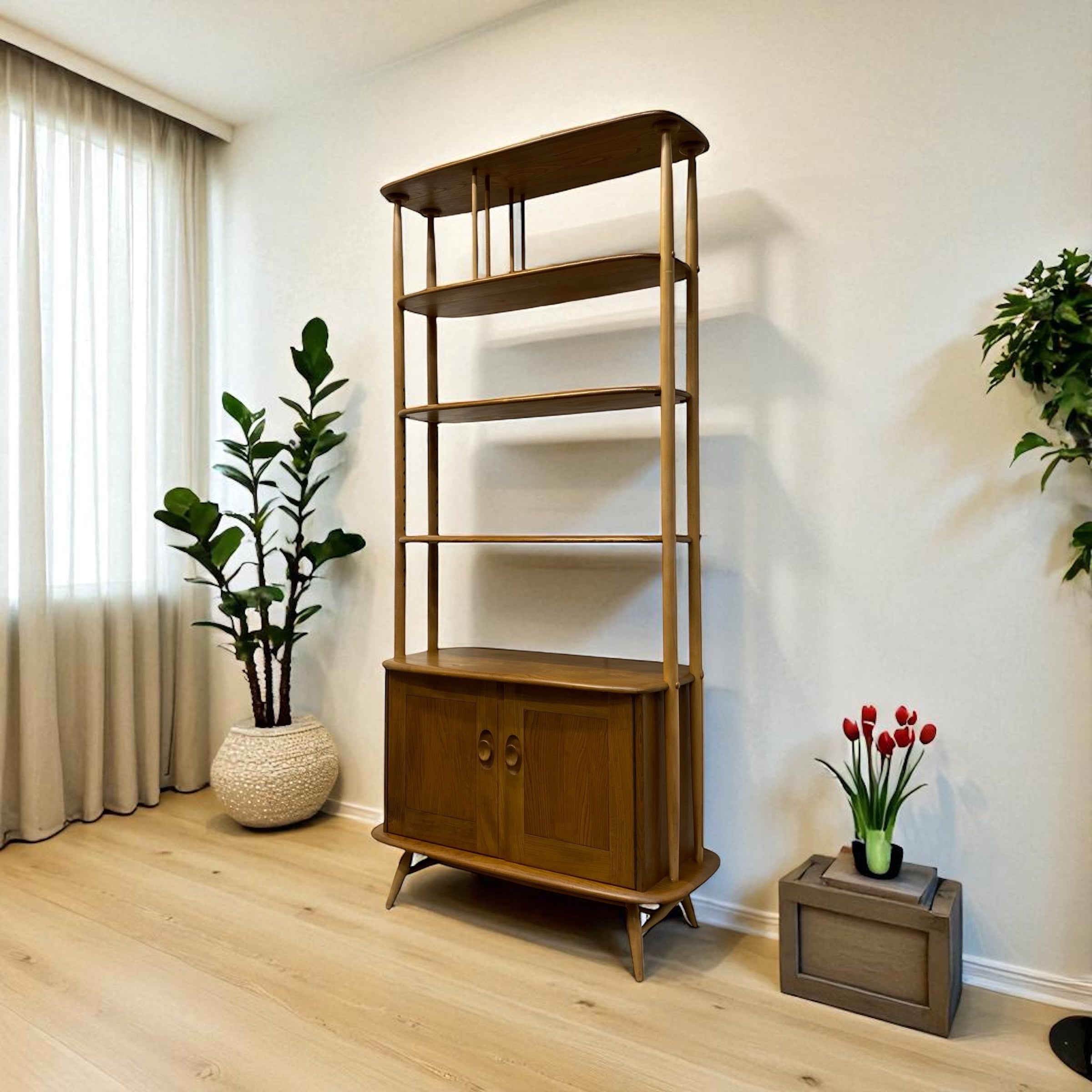 Wooden bookshelf in a room with plants and a curtain