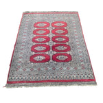 Load image into Gallery viewer, Decorative rug with red and white pattern on a white background
