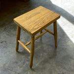 Load image into Gallery viewer, Wooden stool on a concrete floor
