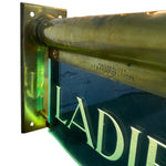 Load image into Gallery viewer, Metallic sign with 'LADIES' and green glow, featuring 'INTERNALITE' branding.
