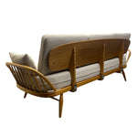 Load image into Gallery viewer, Sofa with wooden frame and beige cushions on a white background
