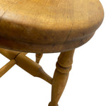 Load image into Gallery viewer, Wooden stool with a round seat and four legs on a white background
