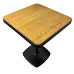 Load image into Gallery viewer, Wooden table with black pedestal base on a white background
