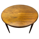 Load image into Gallery viewer, Round wooden table with a white background

