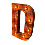 Load image into Gallery viewer, A large decorative letter D marquee light with a distressed orange and brown metallic finish, featuring multiple warm glowing bulbs set around the outer edge, shown on a plain white background.
