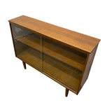 Load image into Gallery viewer, Wooden cabinet with glass doors on a white background
