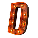 Load image into Gallery viewer, A decorative marquee-style letter D sign with a warm orange and amber marbled finish, illuminated by small round bulbs around the edge, shown on a plain white background.
