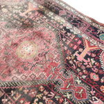 Load image into Gallery viewer, Close-up of a patterned rug with intricate designs.
