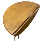 Load image into Gallery viewer, Wooden dining table with a curved top on a white background
