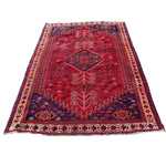 Load image into Gallery viewer, Red and blue patterned rug on a white background
