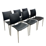 Load image into Gallery viewer, Six modern dining chairs with black leather seats and backs and slim silver metal legs, arranged in two rows against a plain white background.
