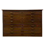 Load image into Gallery viewer, A vintage wooden drawer chest with multiple drawers, brass handles, and red numbering on the front, shown against a plain white background.
