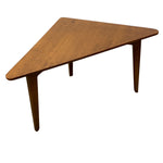 Load image into Gallery viewer, A mid-century modern triangular wooden table with a warm medium-brown finish and tapered legs, shown on a plain white background.
