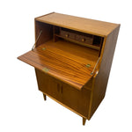 Load image into Gallery viewer, Mid-century modern wooden secretary cabinet with open hinged doors, a pull-out desk surface, two small upper drawers, and brass hardware, shown on a plain white background.
