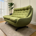 Load image into Gallery viewer, GREEN SOFA IN A SITTING ROOM
