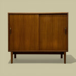 Load image into Gallery viewer, Wooden cabinet with two doors on a beige background
