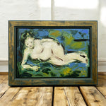 Load image into Gallery viewer, Framed painting of a reclining figure on a wooden floor with white brick wall background
