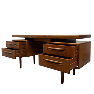 Wooden desk with multiple drawers on a white background
